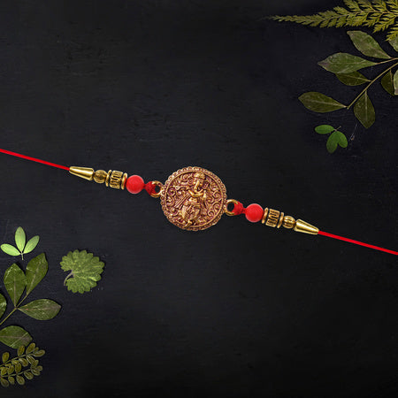 Antique Ganesha Coin Rakhi With Red Beads