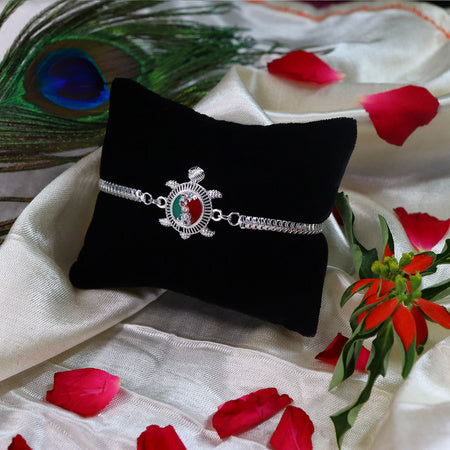 Silver Finish  Rakhi With Red-green Enamel